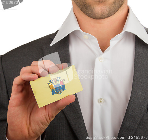 Image of Businessman is holding a business card, New Jersey