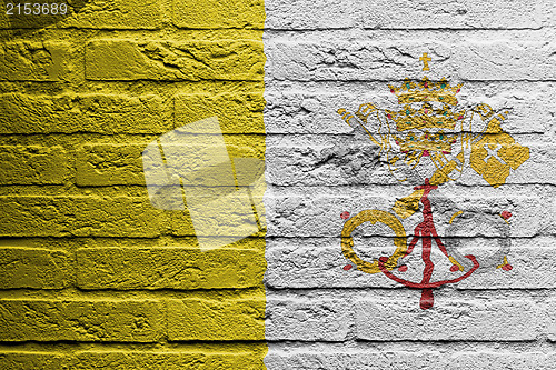 Image of Brick wall with a painting of a flag, Vatican City