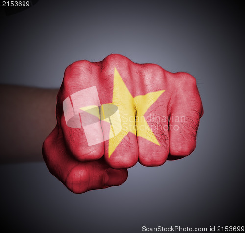 Image of Front view of punching fist on gray background