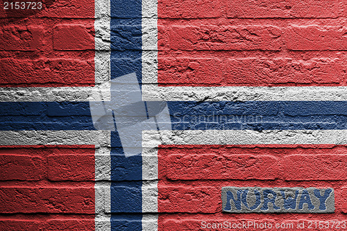 Image of Brick wall with a painting of a flag