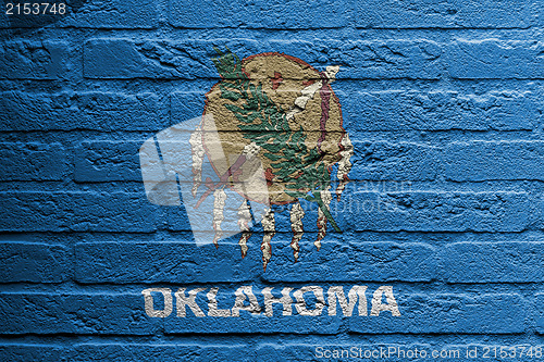 Image of Brick wall with a painting of a flag, Oklahoma