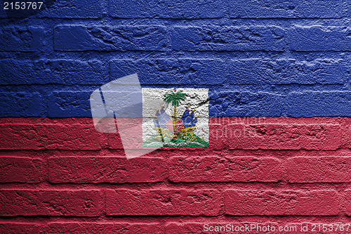 Image of Brick wall with a painting of a flag, Haiti