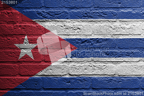 Image of Brick wall with a painting of a flag, Cuba