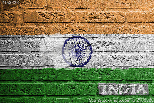 Image of Brick wall with a painting of a flag, India