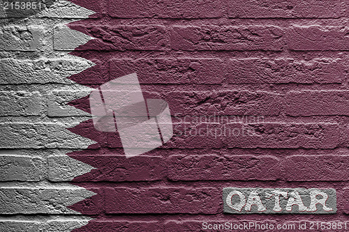 Image of Brick wall with a painting of a flag, Qatar
