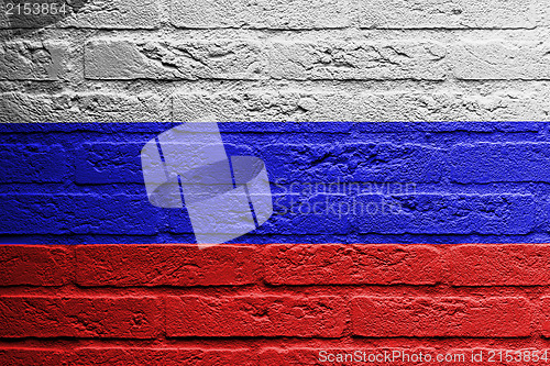 Image of Brick wall with a painting of a flag