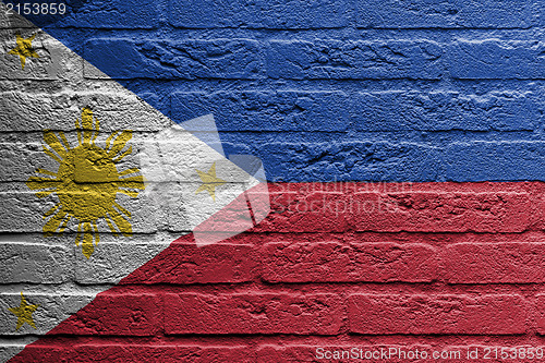 Image of Brick wall with a painting of a flag, The Philippines