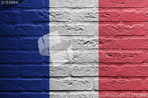 Image of Brick wall with a painting of a flag, France