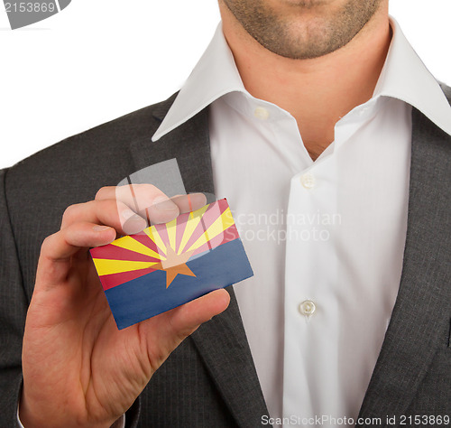 Image of Businessman is holding a business card, Arizona