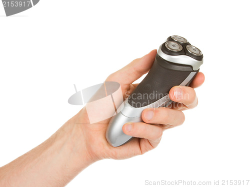 Image of Hand holding an electric shaver 