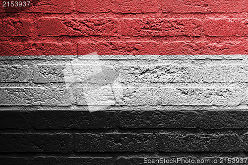 Image of Brick wall with a painting of a flag, Yemen