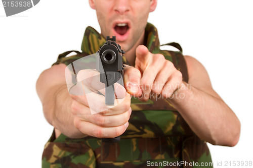 Image of Soldier in camouflage vest is holding a gun