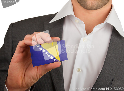 Image of Businessman is holding a business card, Bosnia and Herzegovina