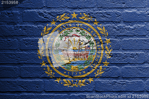 Image of Brick wall with a painting of a flag, New Hampshire