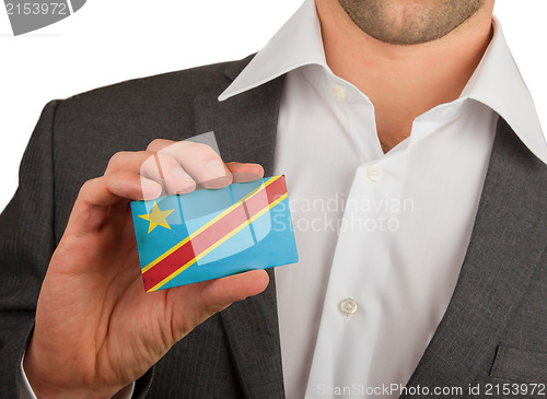 Image of Businessman is holding a business card, The Democratic Republic 