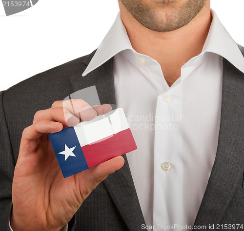 Image of Businessman is holding a business card, Texas