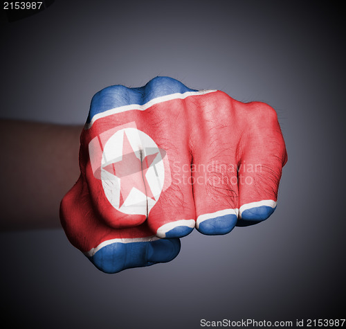 Image of Front view of punching fist on gray background
