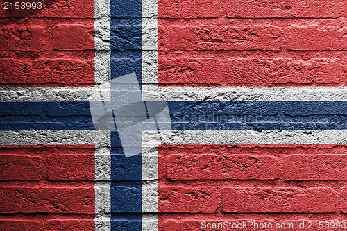 Image of Brick wall with a painting of a flag