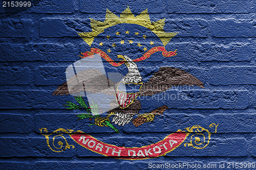 Image of Brick wall with a painting of a flag, North Dakota