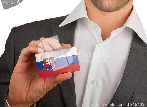 Image of Businessman is holding a business card, Slovakia