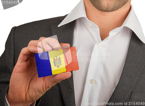 Image of Businessman is holding a business card, Andorra