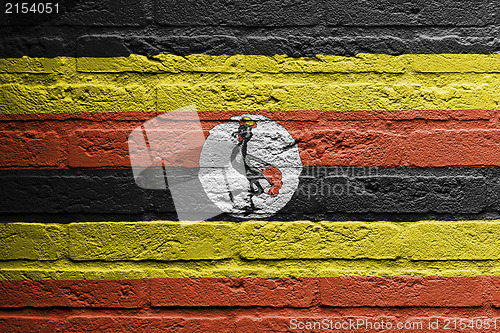 Image of Brick wall with a painting of a flag, Uganda