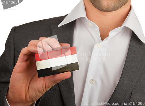 Image of Businessman is holding a business card, Yemen
