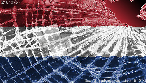 Image of Broken glass or ice with a flag, the Netherlands