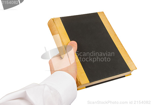 Image of Businessman holding an old book