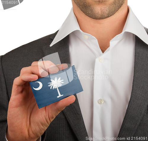 Image of Businessman is holding a business card, South Carolina