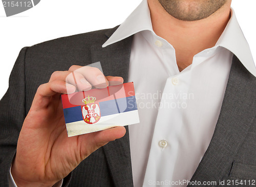 Image of Businessman is holding a business card, Serbia
