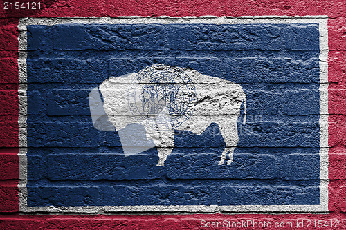 Image of Brick wall with a painting of a flag, Wyoming