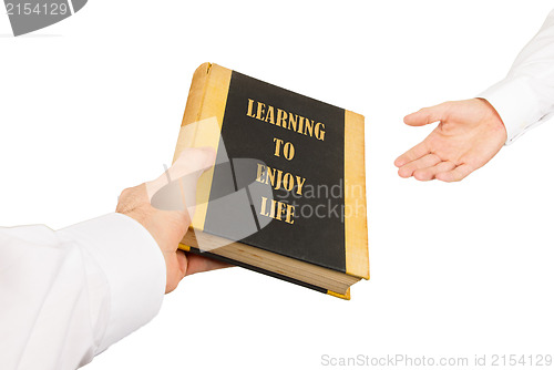 Image of Businessman giving an used book to another businessman