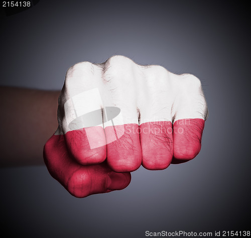 Image of Front view of punching fist on gray background