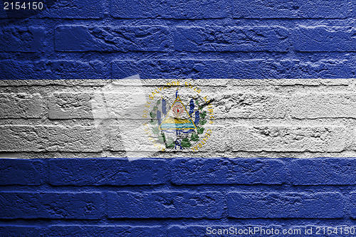 Image of Brick wall with a painting of a flag, El Salvador