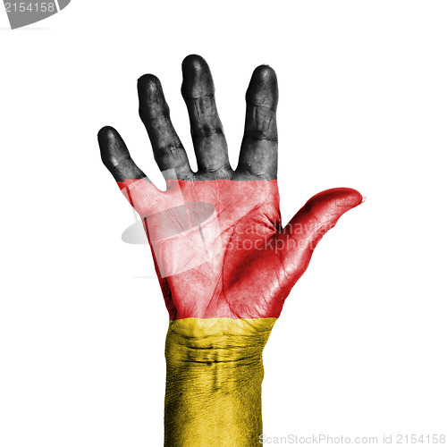Image of Hand of an old woman, wrapped with a pattern of the flag of Germ