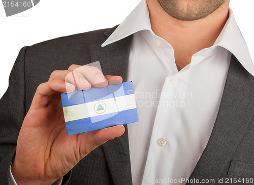 Image of Businessman is holding a business card, Nicaragua