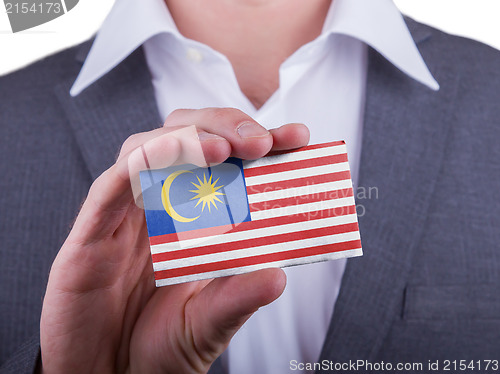 Image of Businessman showing card, matte paper effect