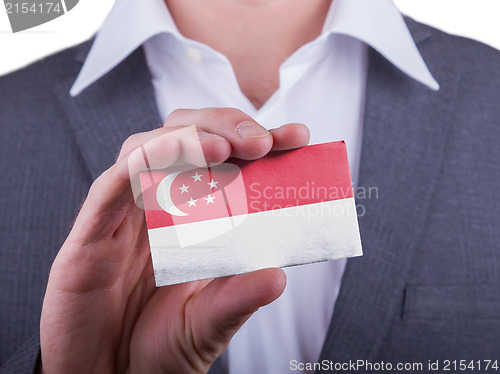 Image of Businessman showing card, matte paper effect