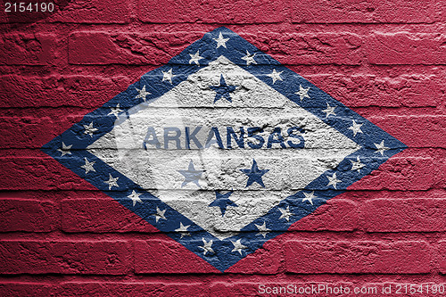 Image of Brick wall with a painting of a flag, Arkansas
