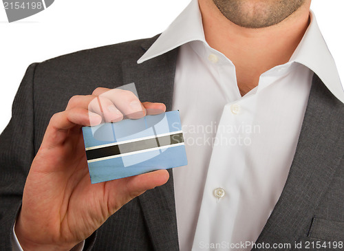 Image of Businessman is holding a business card, Botswana