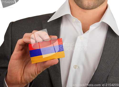 Image of Businessman is holding a business card, Armenia