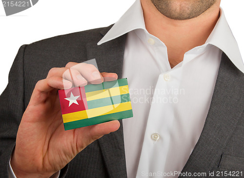 Image of Businessman is holding a business card, Togo