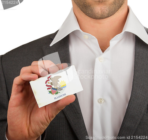 Image of Businessman is holding a business card, Illinois