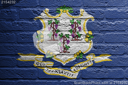 Image of Brick wall with a painting of a flag, Connecticut