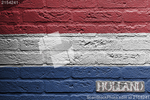 Image of Brick wall with a painting of a flag, Holland