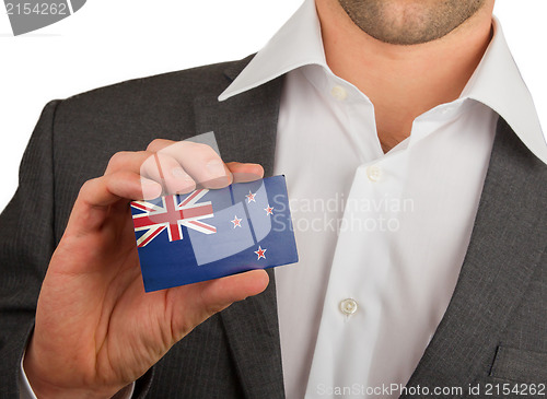 Image of Businessman is holding a business card, 