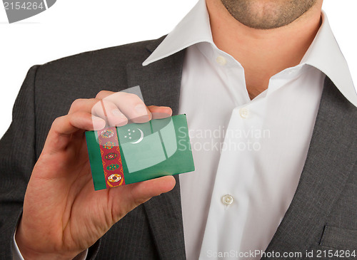 Image of Businessman is holding a business card, Turkmenistan