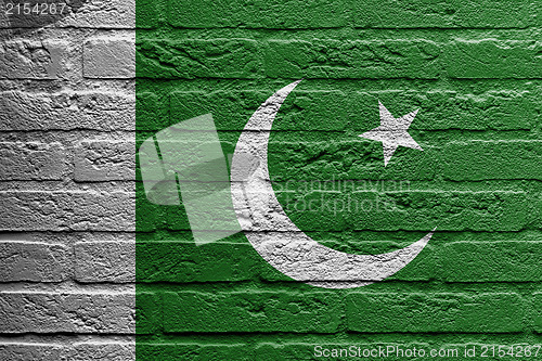 Image of Brick wall with a painting of a flag, Pakistan