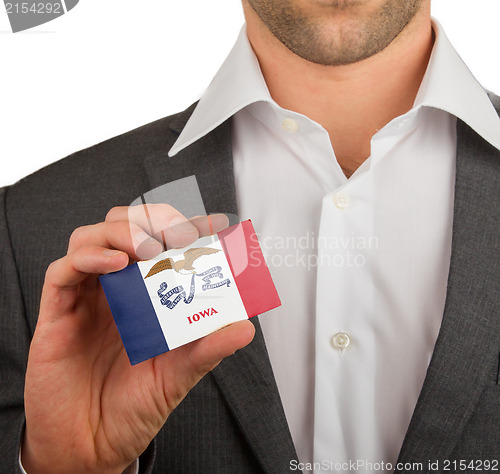 Image of Businessman is holding a business card, Iowa
